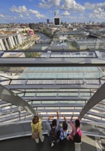 Interior view of the Reichstag dome with visitors on the ramp and view of the cityscape, Reichstag
