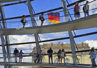 Interior view of the Reichstag dome with visitors on the ramps and the German flag, Reichstag