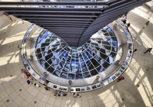 Reichstag dome, interior view from top to bottom of the mirror cone with visitors, Reichstag