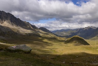 Alpe Carorescio with Piano Grande plateau and hiking trail marker, Quinto, Ticino, Switzerland