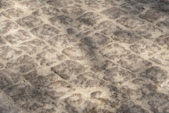 Cobblestone pavement, textured background, copy space