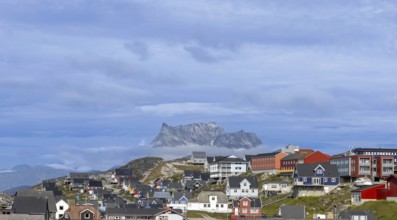 Panoramic view of Greenland capital Nuuk with colored houses located near fjords and icebergs