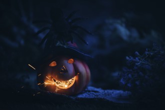 Glowing pumpkin with spider and sparks, dark, spooky, Halloween