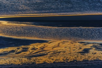 Evening sun reflected in the Wadden Sea at low tide, sun, sea, natural spectacle, Sylt
