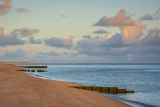 Sunrise on Ellenbogen beach, breakwater, coastal protection, North Sea island of Sylt