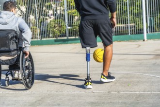 Young men with disabilities enjoying a basketball game together on an outdoor court, embracing