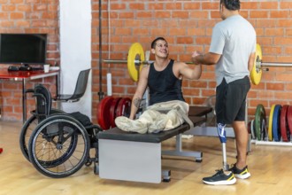 Two men with disabilities celebrate progress in a modern gym, fist bumping after a workout one