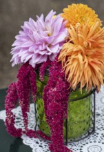 Small bouquet with dahlias and foxtail in a green glass vase, North Rhine-Westphalia, Germany