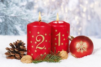 Second 2nd Advent candle for Christmas Christmas card in winter with copy space Copyspace in