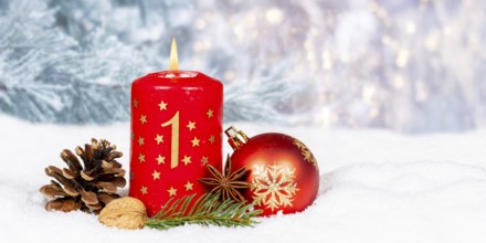 First 1st Advent candle for Christmas Christmas card in winter with text free space Copyspace