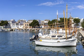 Portocolom fishing village on Majorca with boats and colourful houses Holiday by the sea in