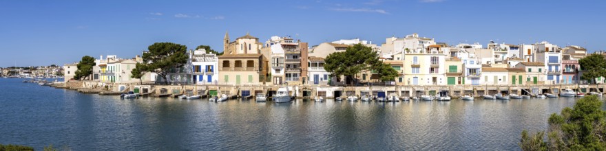 Colourful houses in Portocolom Fishing village on Majorca Panorama with boats Holiday by the sea