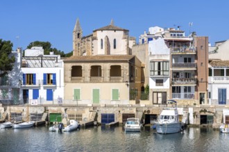 Colourful houses in Portocolom Fishing village on Majorca with boats Seaside holiday in Portocolom,