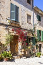 Valldemossa village on Majorca building with flowers trip in Valldemossa, Spain