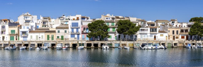 Colourful houses in Portocolom Fishing village on Majorca with boats Holiday by the sea Panorama