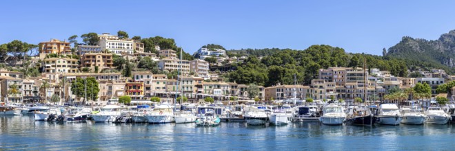 Port de Soller town on Majorca holiday by the sea yacht harbour with boats panoramic trip in Port