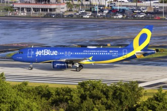 A JetBlue Airways Airbus A320 aircraft with the registration N775JB and the JetBlue Honours our