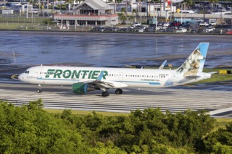A Frontier Airlines Airbus A321 aircraft with registration N717FR at San Juan Airport, Puerto Rico