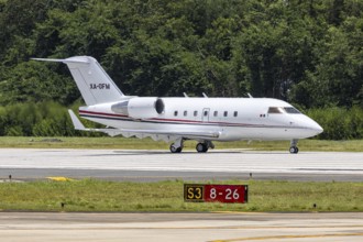 A Bombardier Challenger 604 private jet aircraft with the registration XA-OFM at San Juan Airport,