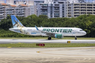 A Frontier Airlines Airbus A320 aircraft with the registration number N233FR at San Juan Airport,