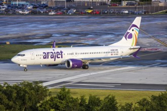 An Arajet Boeing 737 MAX 8 aircraft with registration number HI1082 at San Juan Airport, Puerto