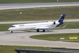 A Lufthansa Bombardier CRJ-900 aircraft with the registration D-ACNI at Munich Airport, Germany
