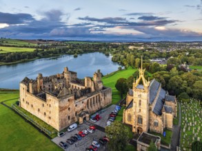 Sunset over Linlithgow Palace from a drone, Linlithgow Loch, West Lothian, Scotland, United Kingdom