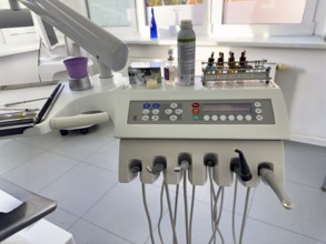 Instruments drills for dental treatment dental hygiene on panel board console with digital display