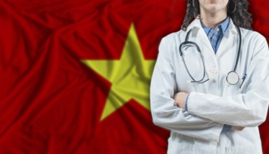 Medical professional on Vietnam flag. Healthcare and wellness in Vietnam, Concept