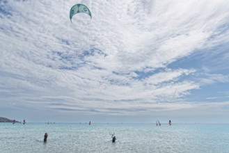 Prasonisi's expansive sea under a big sky with kitesurfers. Lively, sporty atmosphere, Prasonisi,