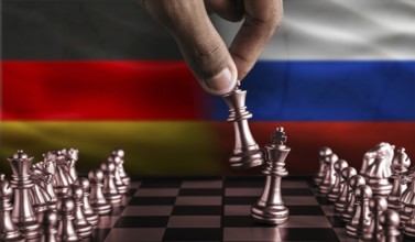 Political tension between Germany and Russia. Germany vs Russia flag on chessboard