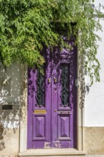 The old town centre of Tavira, typical door knockers found on many wooden doors in the town,