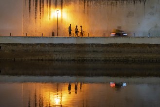 Evening in the old town centre, by the Gilao River, Tavira, in the Algarve, Portugal