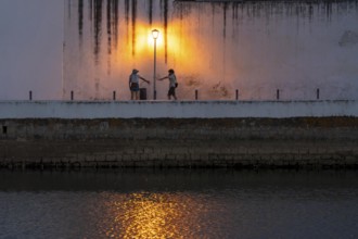 Evening in the old town centre, by the Gilao River, Tavira, in the Algarve, Portugal