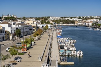 The old town centre of Tavira, on the Gilao River, boats, fishing boats, waterfront promenade, in