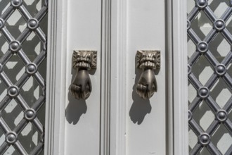 The old town centre of Tavira, typical door knockers found on many wooden doors in the town,