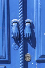 The old town centre of Tavira, typical door knockers found on many wooden doors in the town,