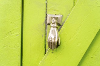 The old town centre of Tavira, typical door knockers found on many wooden doors in the town,