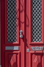 The old town centre of Tavira, typical door knockers found on many wooden doors in the town,