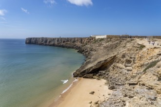 Rocky coast, cliffs in the south-west of the Algarve, near Sagres, old fortress Fortaleza de