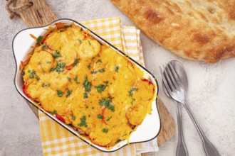 Madame Bovary's Georgian dish, chicken fillet with mushrooms, tomatoes and cheese, baked in a mold