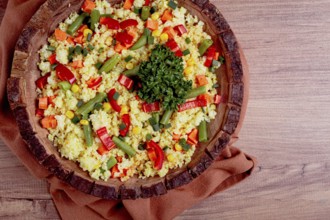 Couscous with vegetables, paprika, carrots, string beans, corn, homemade, top view, no people