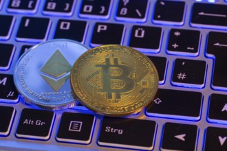 Cryptocurrencies: Close-up of a symbolic Bitcoin and Ethereum