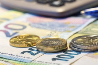Close-up of euro banknotes and euro coins