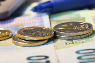 Close-up of euro banknotes and euro coins