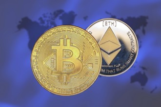 (Photomontage) Cryptocurrencies: Symbolic Bitcoin and Ethereum, cropped in front of a world map