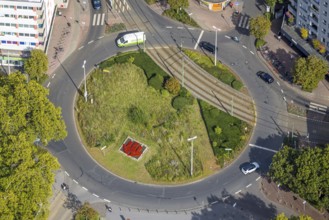 Aerial view, green roundabout and flower bed at D'Agen square and tram line, Dinslaken, Ruhr area,