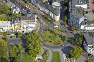 Aerial view, green roundabout and flower bed at D'Agen square and tram line, Dinslaken, Ruhr area,
