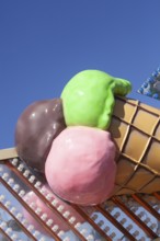 Ice cream cone with colourful ice cream scoops as decoration at the Bremer Osterwiese folk