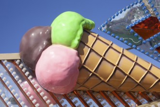 Ice cream cone with colourful ice cream scoops as decoration at the Bremer Osterwiese folk